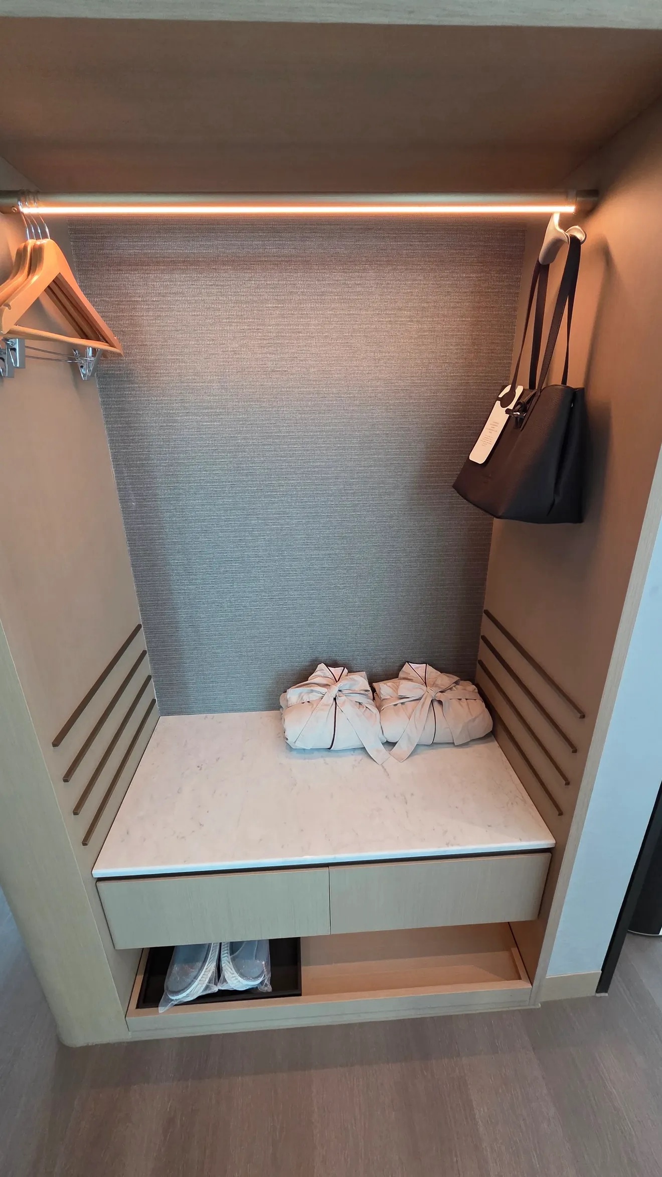 Closet with bathrobes and slippers