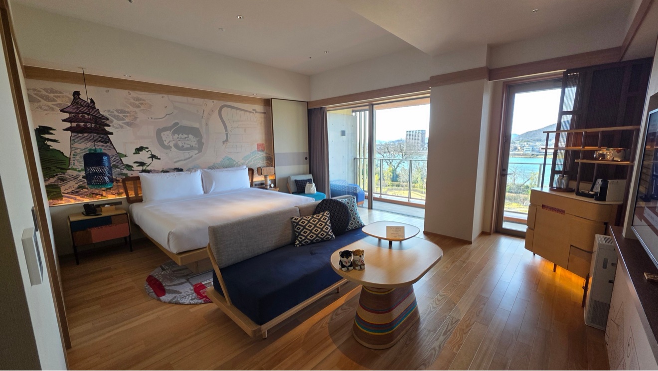 Suite panorama with mural wall and sofa