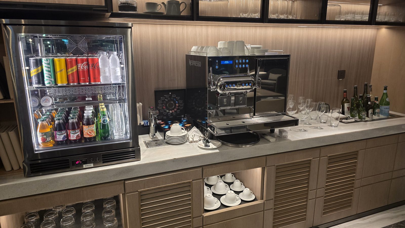 The drinks fridge: sodas and juices in neat rows
