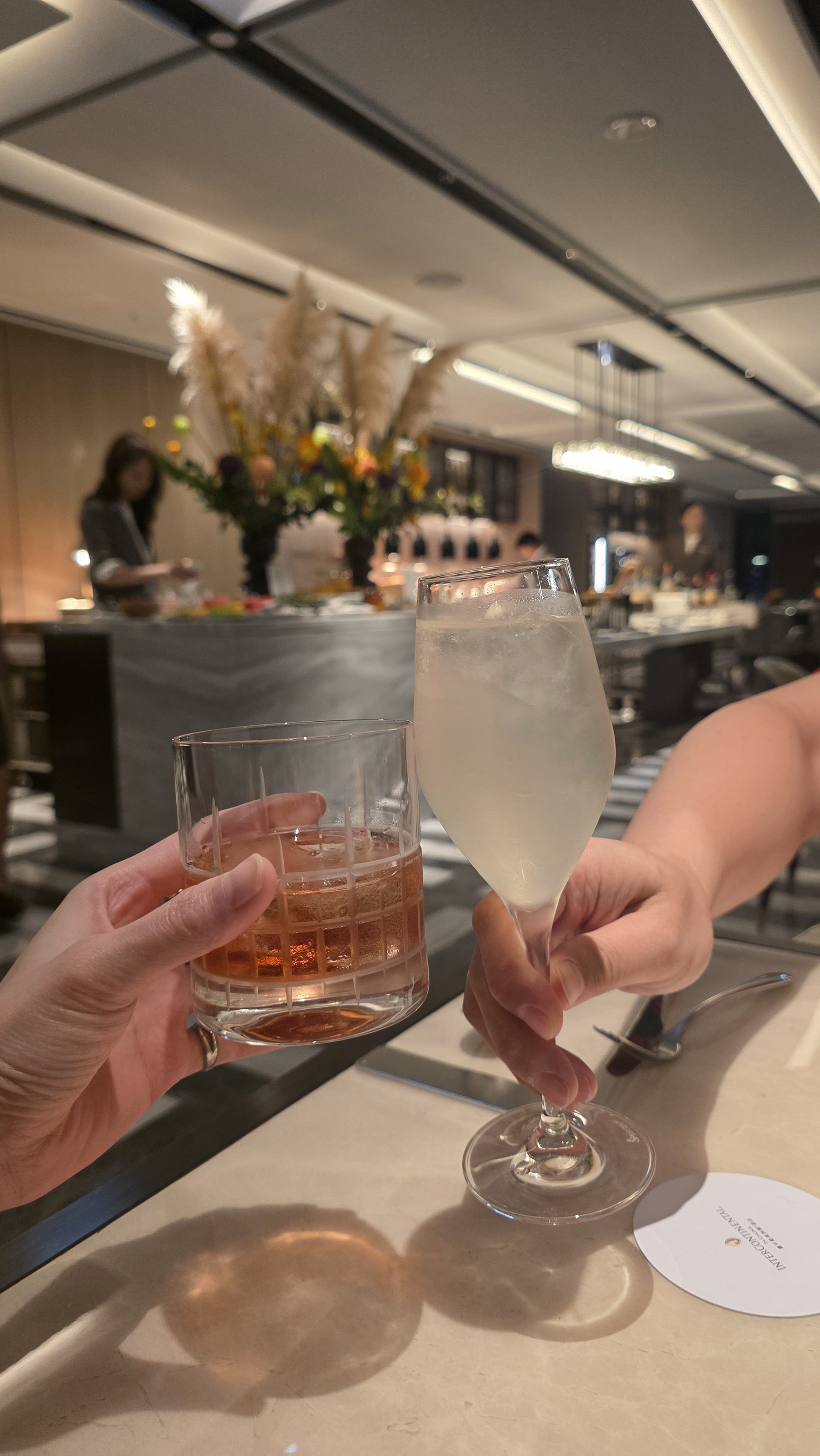 Whisky in hand, the city turned to night outside