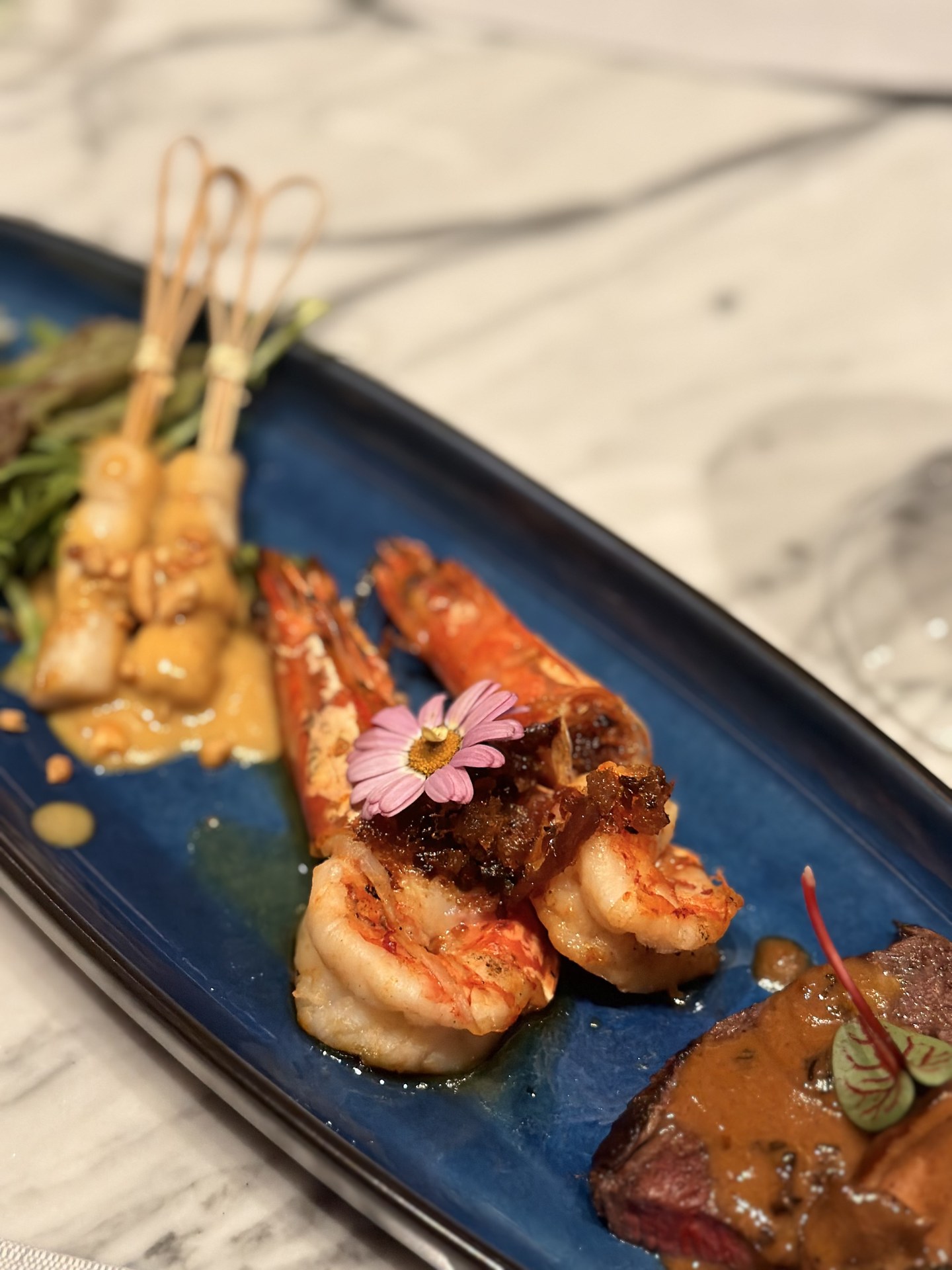 Prawns and skewers, close up.